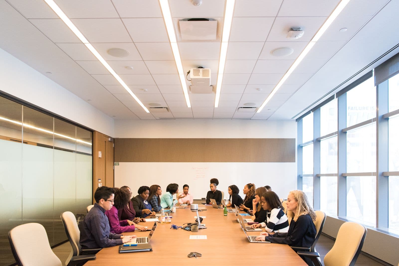 Professionals in a strategy meeting in a modern office.