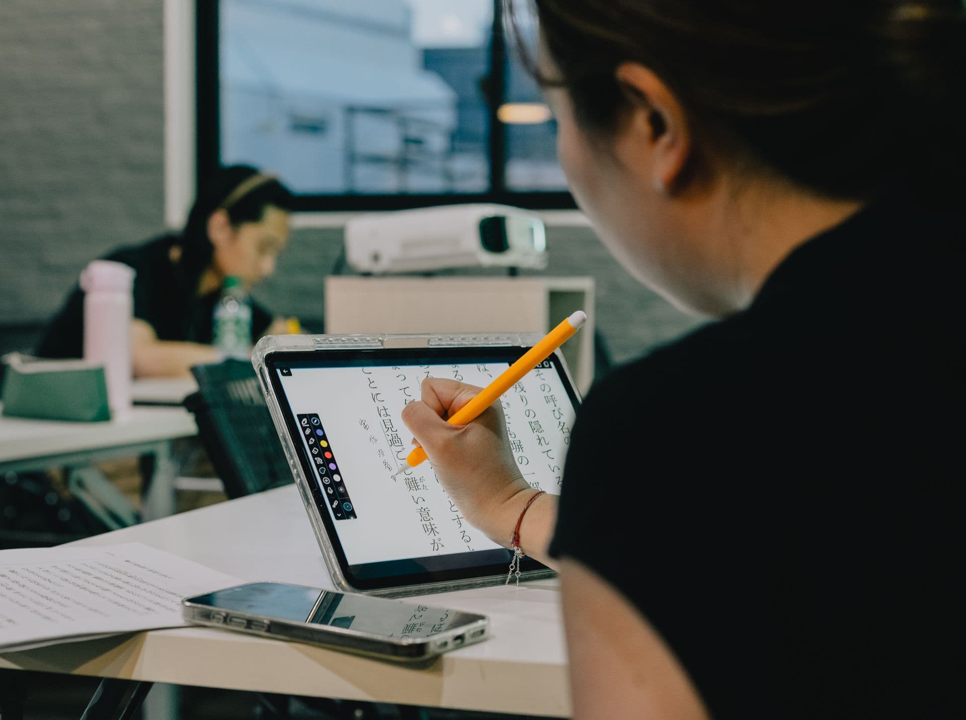 A classroom where students are working with technology.